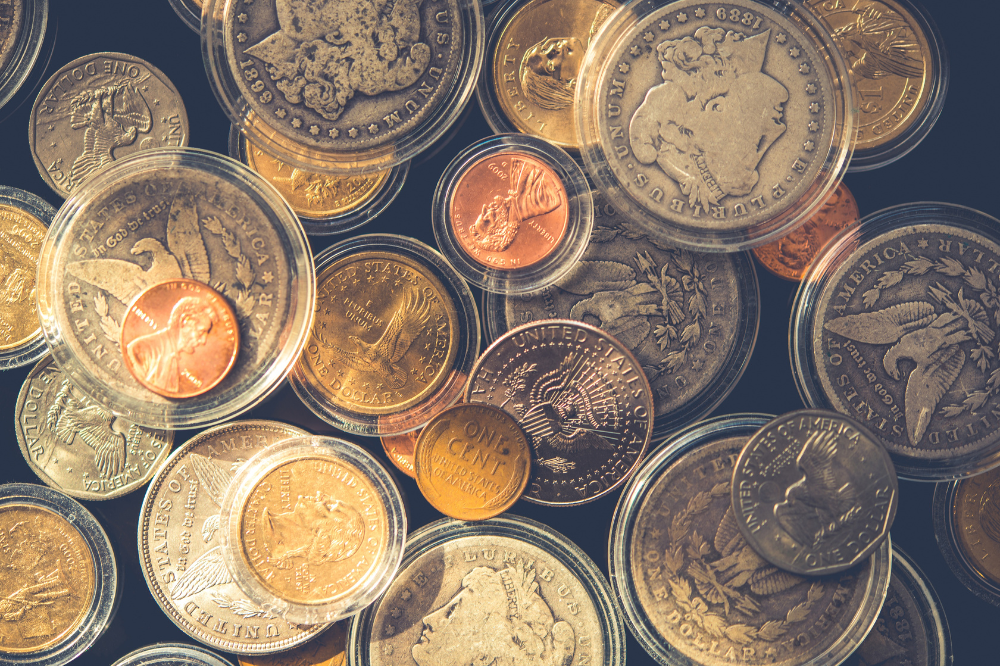 Variety of collectible U.S. coins in plastic holders — Coin Buyers in Abilene.